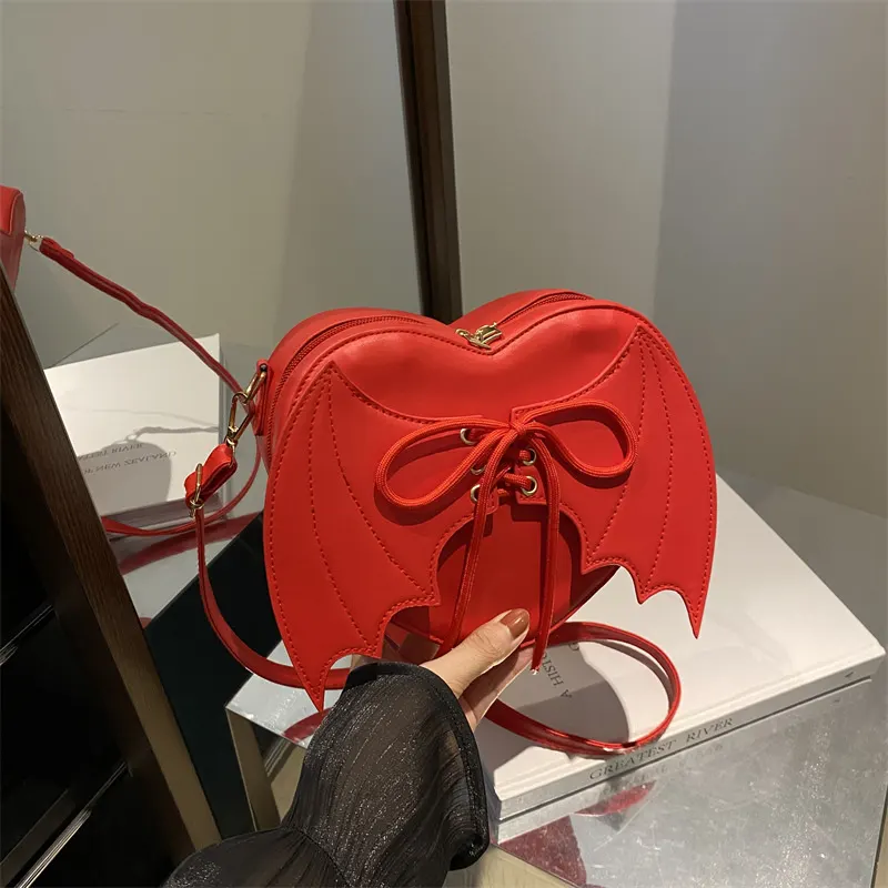 Heart Shaped Bat Wing Crossbody Bag